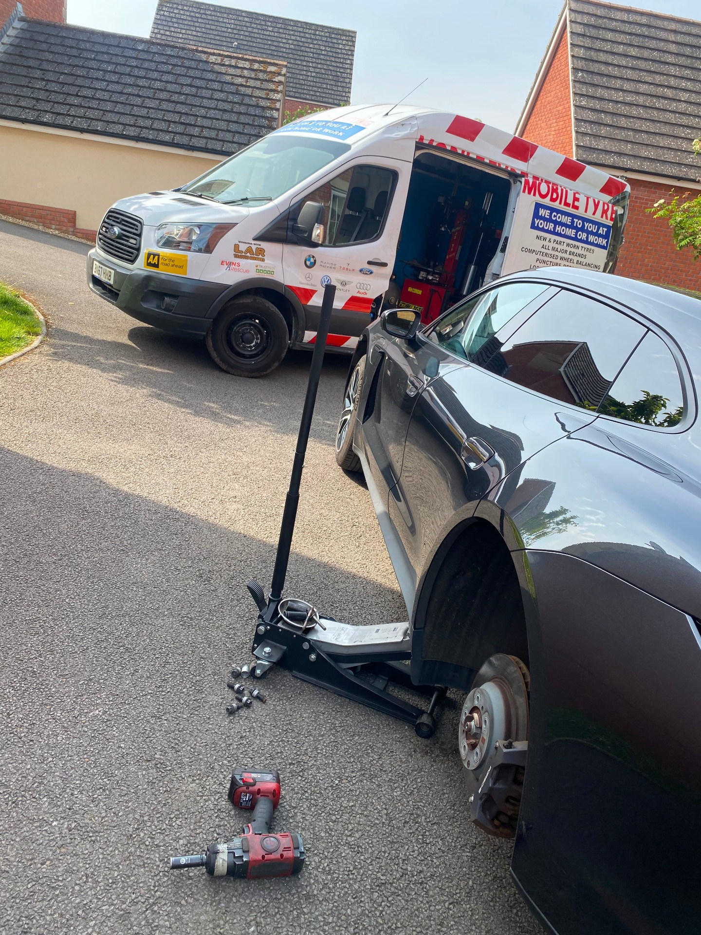 Tyre valve replacement — hub and rotor view of a customer vehicle during service